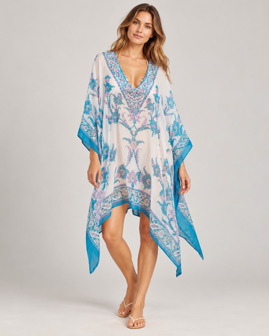White and blue floral print beach cover-up with blue border worn by a model, KK Fashion Exports