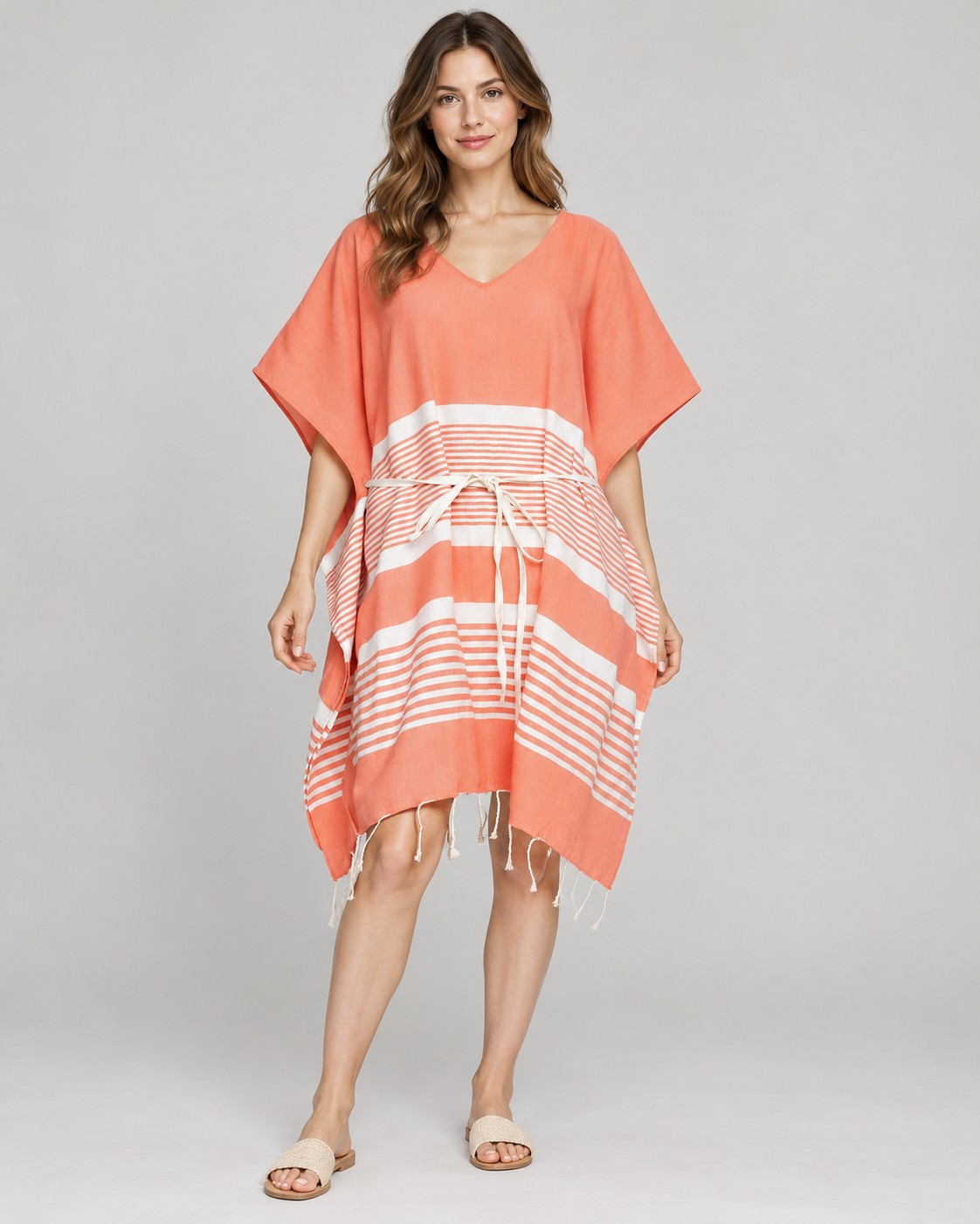 Coral and white striped cotton poncho with tie belt and fringe worn by a model, KK Fashion Exports