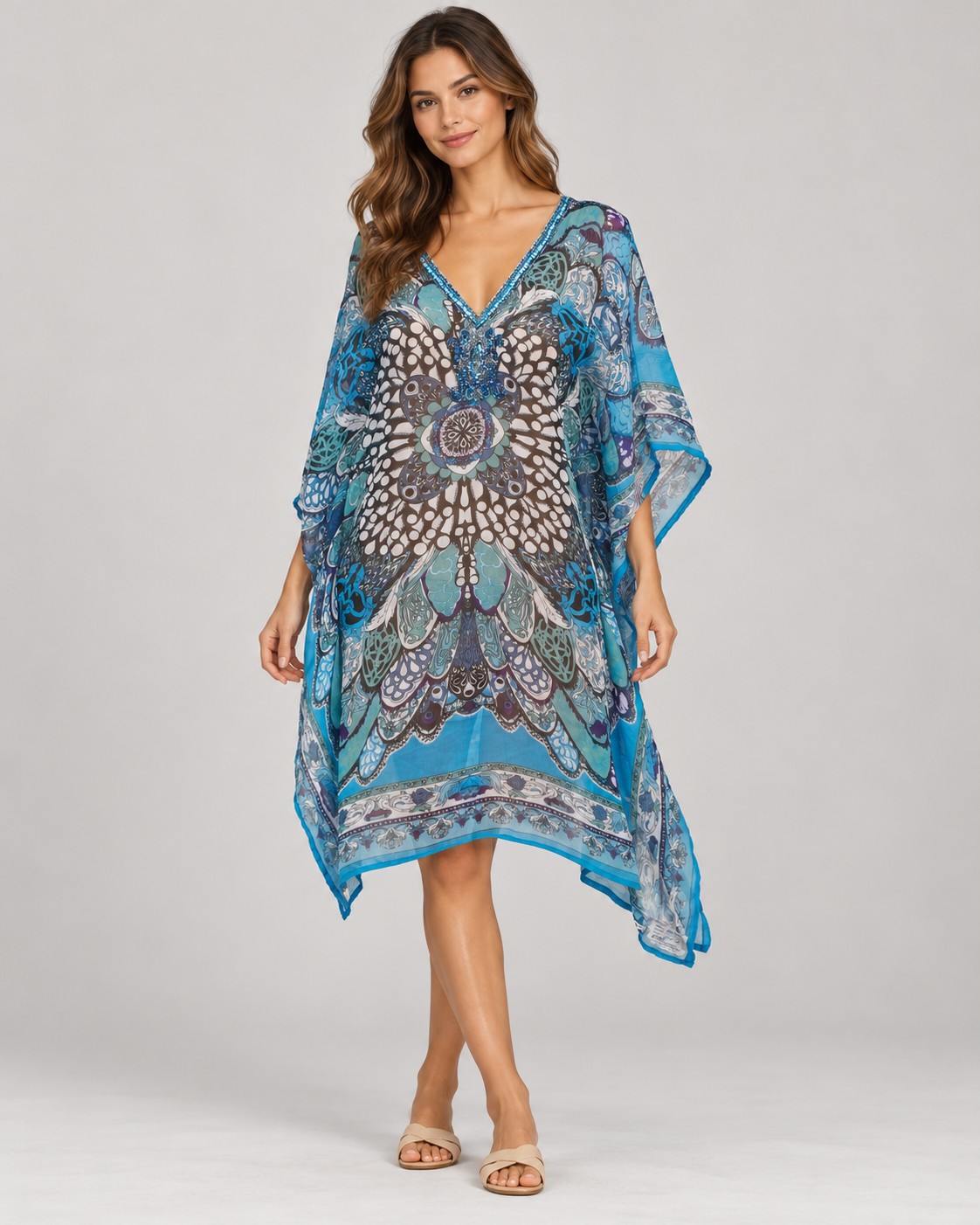 Blue and brown mosaic print poncho worn by a model, KK Fashion Exports