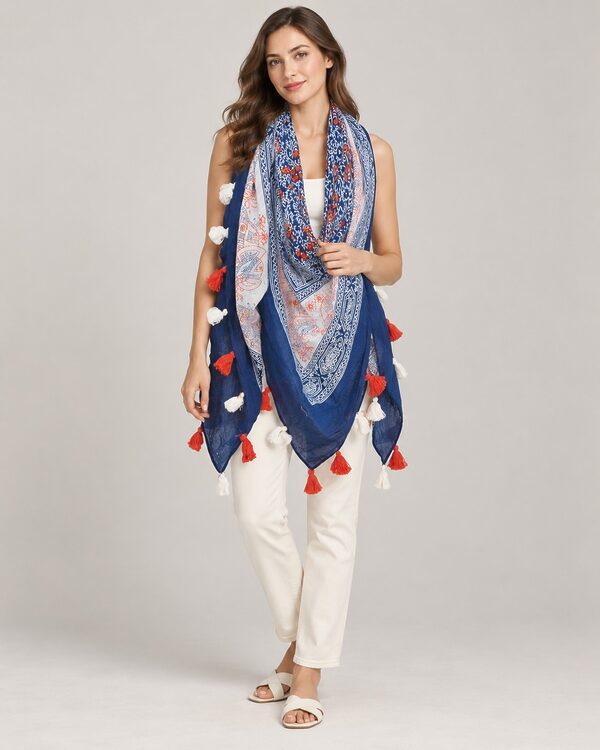 Navy and white paisley print cotton scarf with red and white tassels worn by a model, KK Fashion Exports