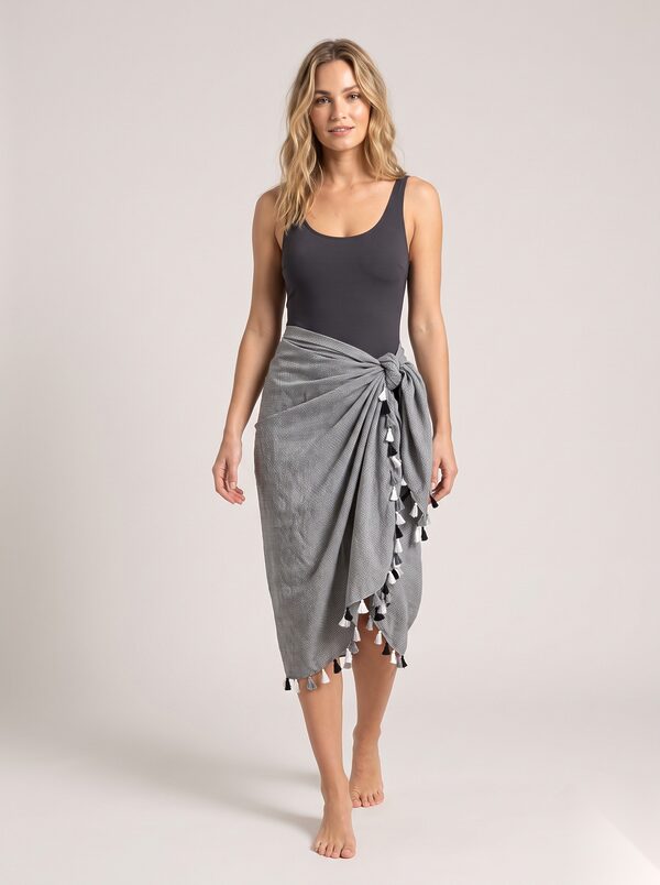 Grey cotton pareo with black and white tassels worn by a model, KK Fashion Exports