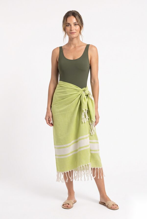 Lime green cotton fouta pareo with white stripes and fringe worn by a model, KK Fashion Exports