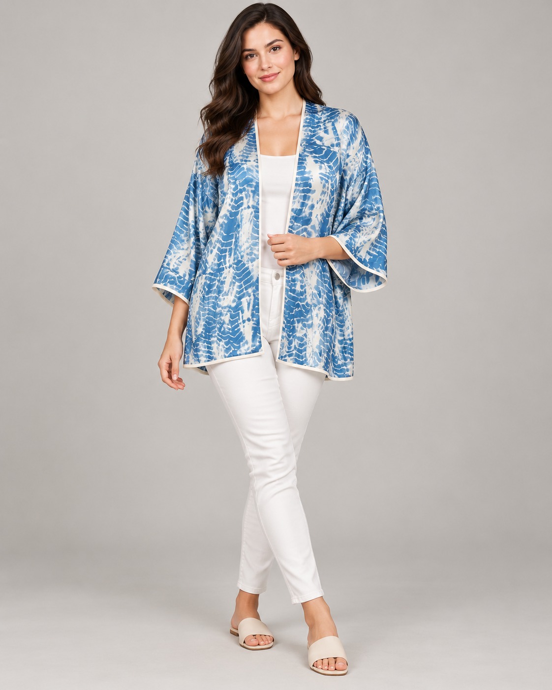 Satin hip-length kimono with contrast piping in a shibori resist-dyed vertical columns of fern fronds print.