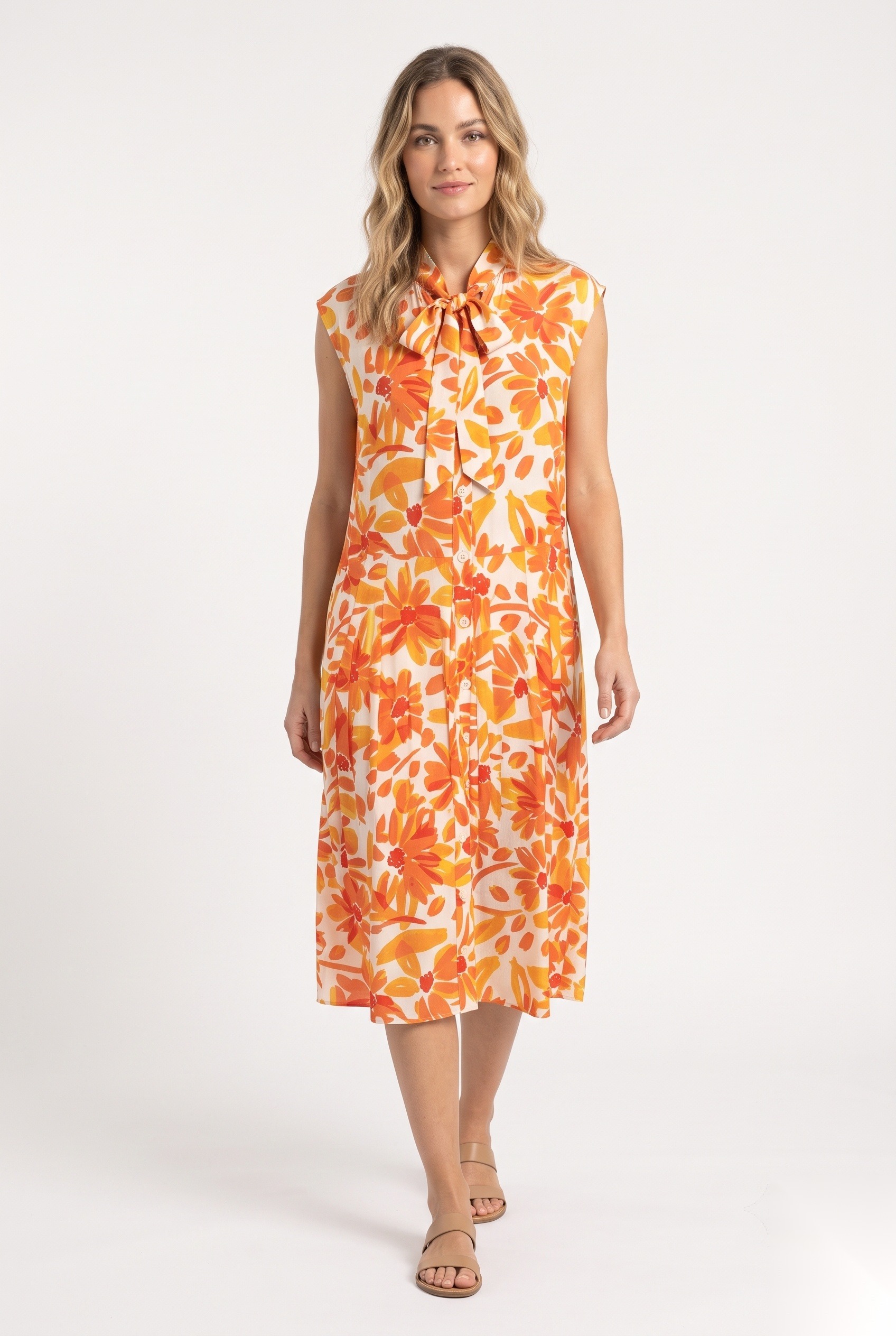Silk relaxed shift dress with a tie neck in a all-over painterly radiating daisy heads and botanical leaves print.