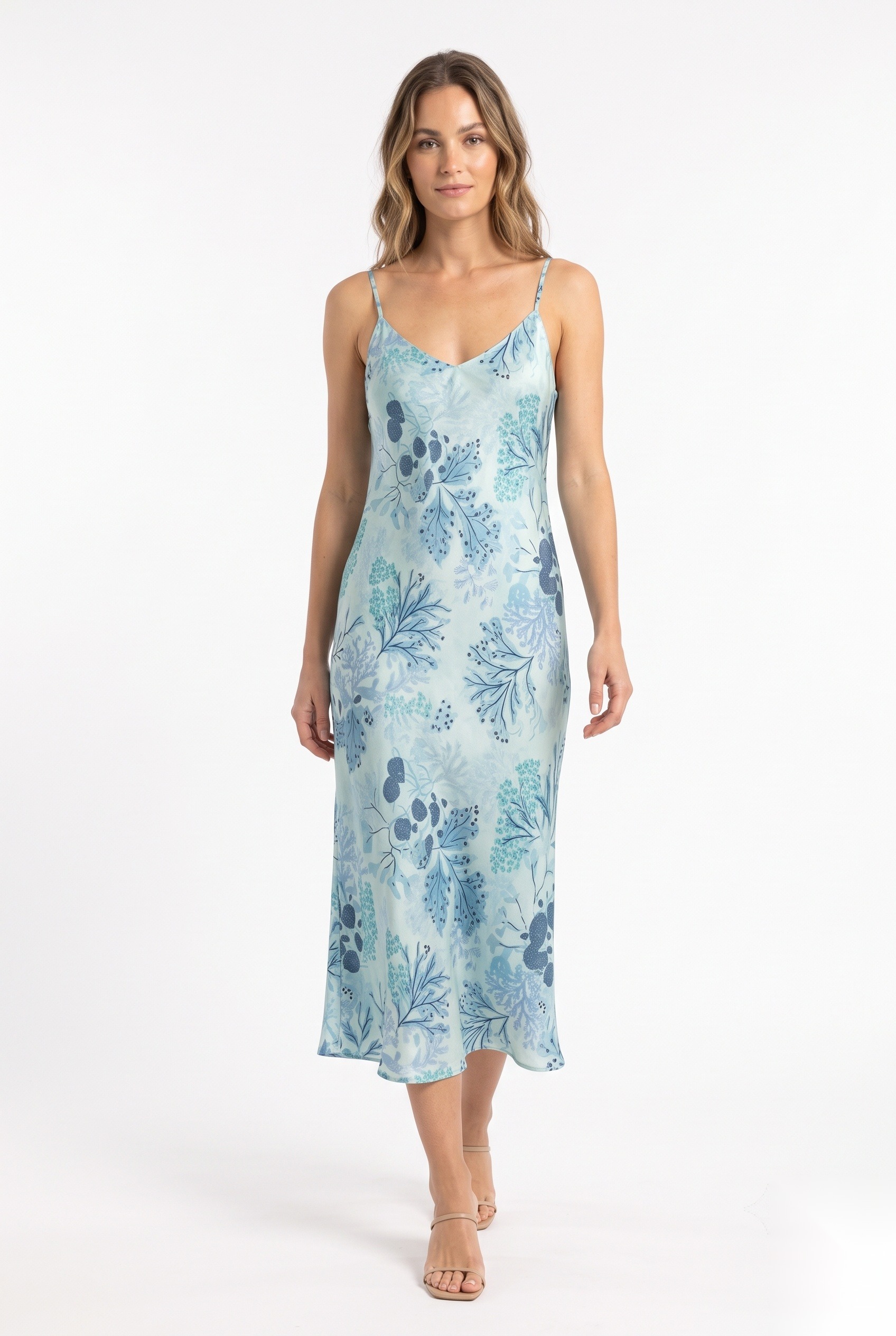 Silk bias-cut midi slip dress in a dense layered botanical fronds and clustered berry stems print.