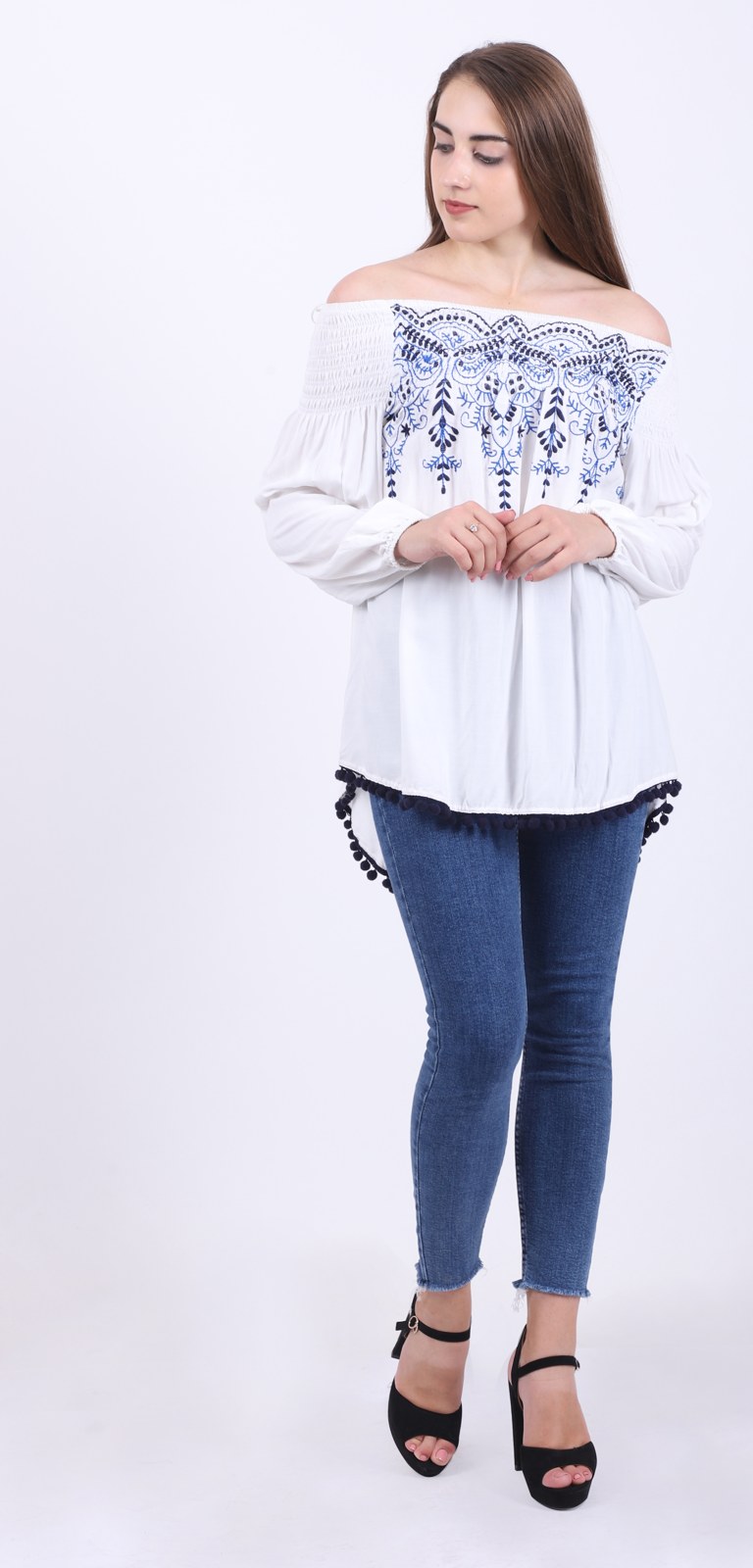 Off-shoulder white top with blue embroidery