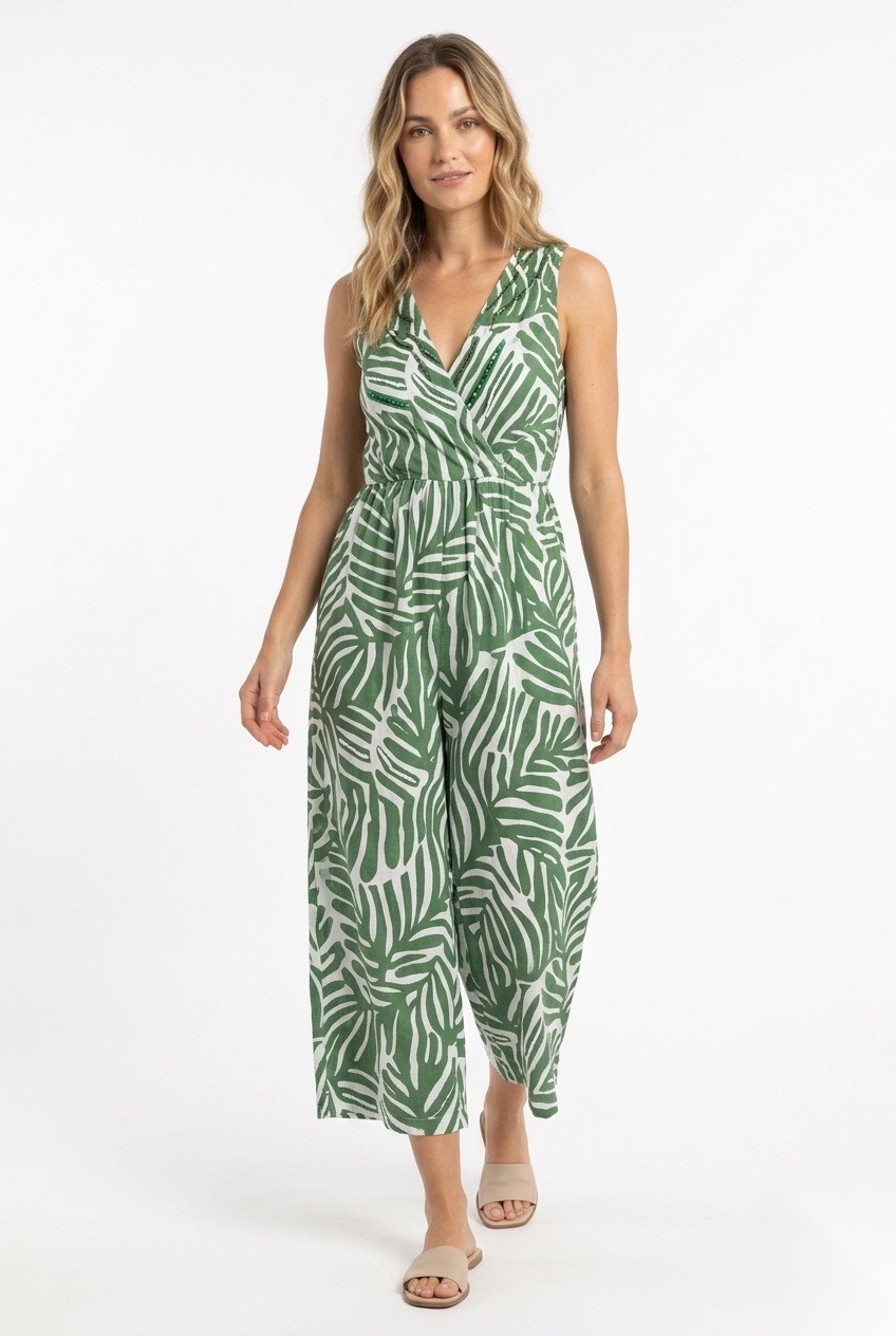 Linen wrap-front culotte jumpsuit in a dense overlapping stylized palm leaves with elongated lobes print.
