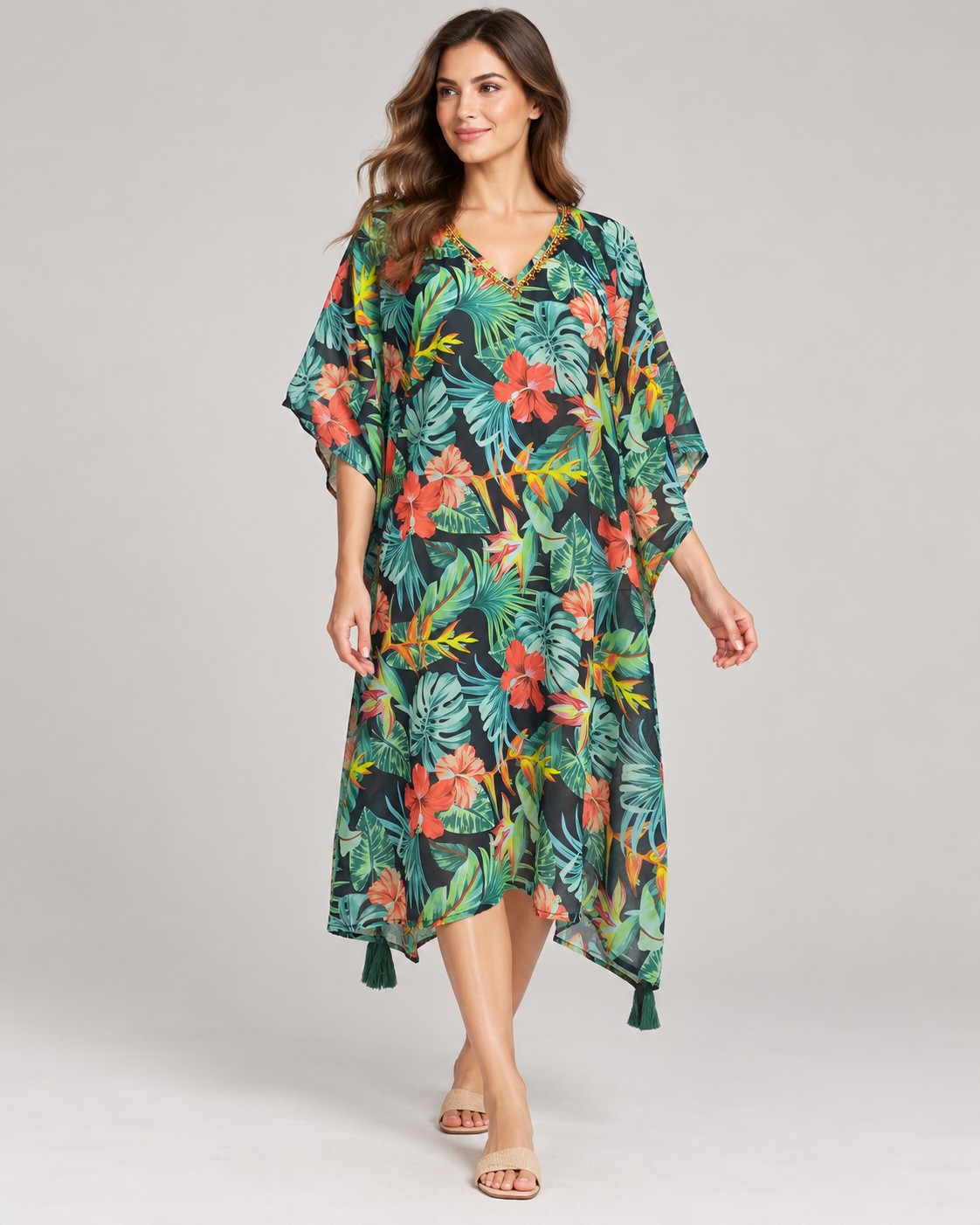 Green tropical floral print kaftan with tassels worn by a model, KK Fashion Exports
