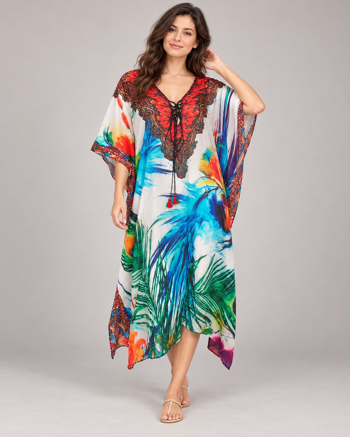 White kaftan with blue and green tropical print and red lace neckline worn by a model, KK Fashion Exports