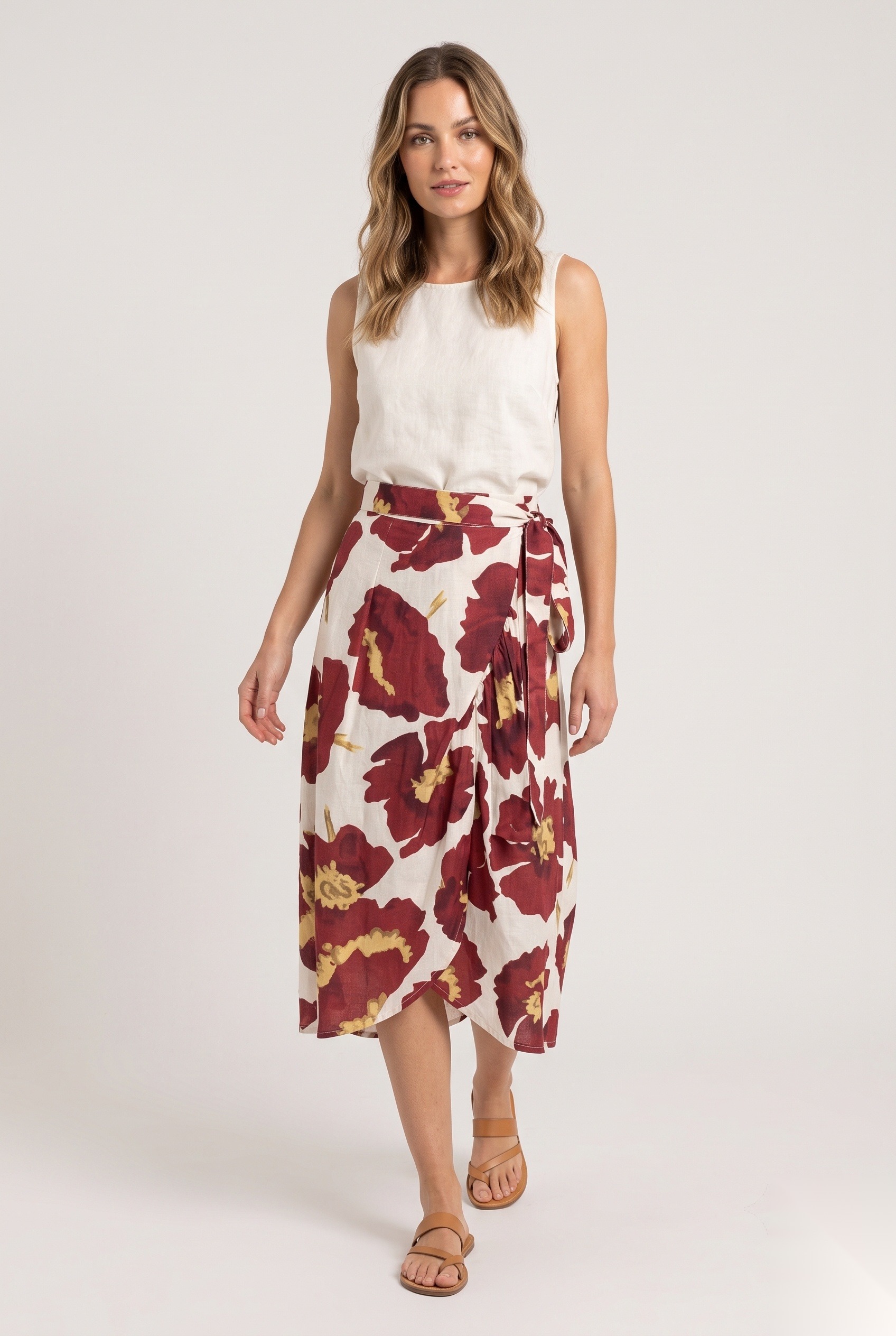 Linen wrap midi skirt with a tie in a oversized bold flower blooms with ruffled petal edges print.