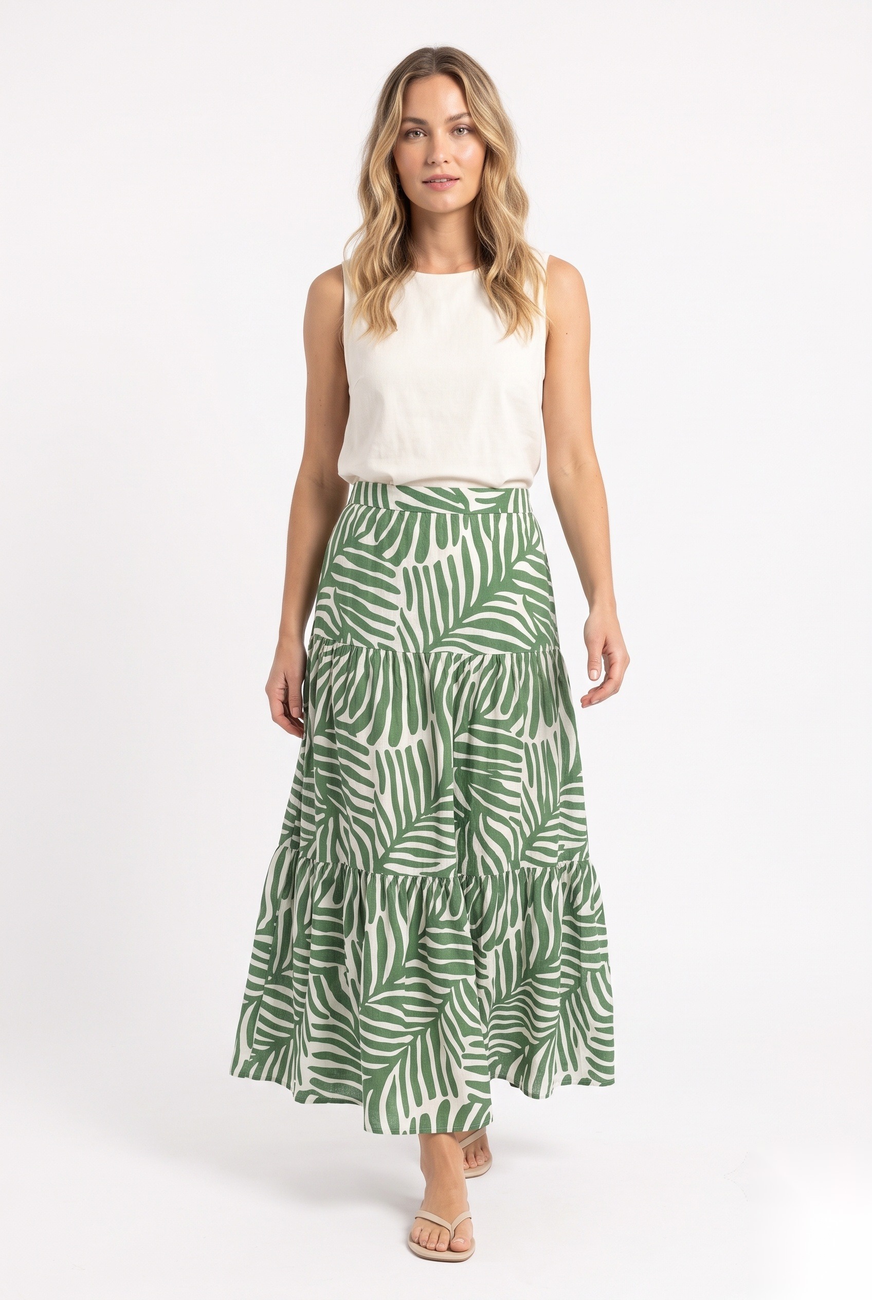 Linen tiered maxi skirt in a dense overlapping stylized palm leaves with elongated lobes print.