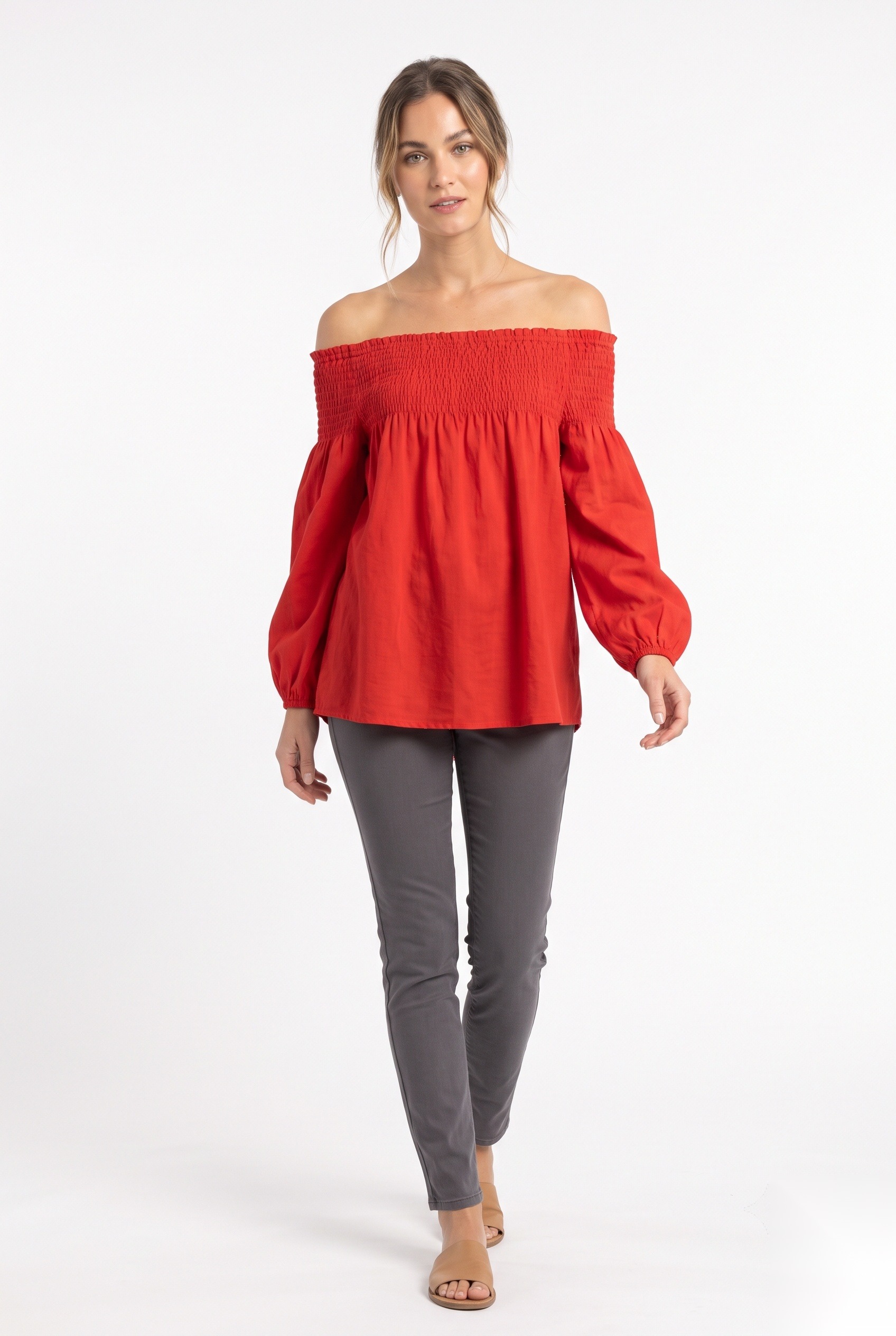 Red smocked off-shoulder top with balloon sleeves worn by a model, KK Fashion Exports