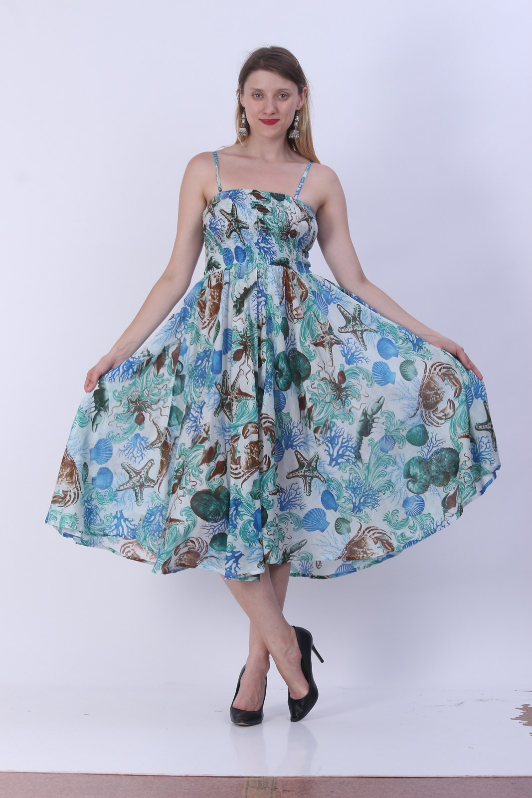 Blue floral print smocked umbrella dress with a full circle skirt