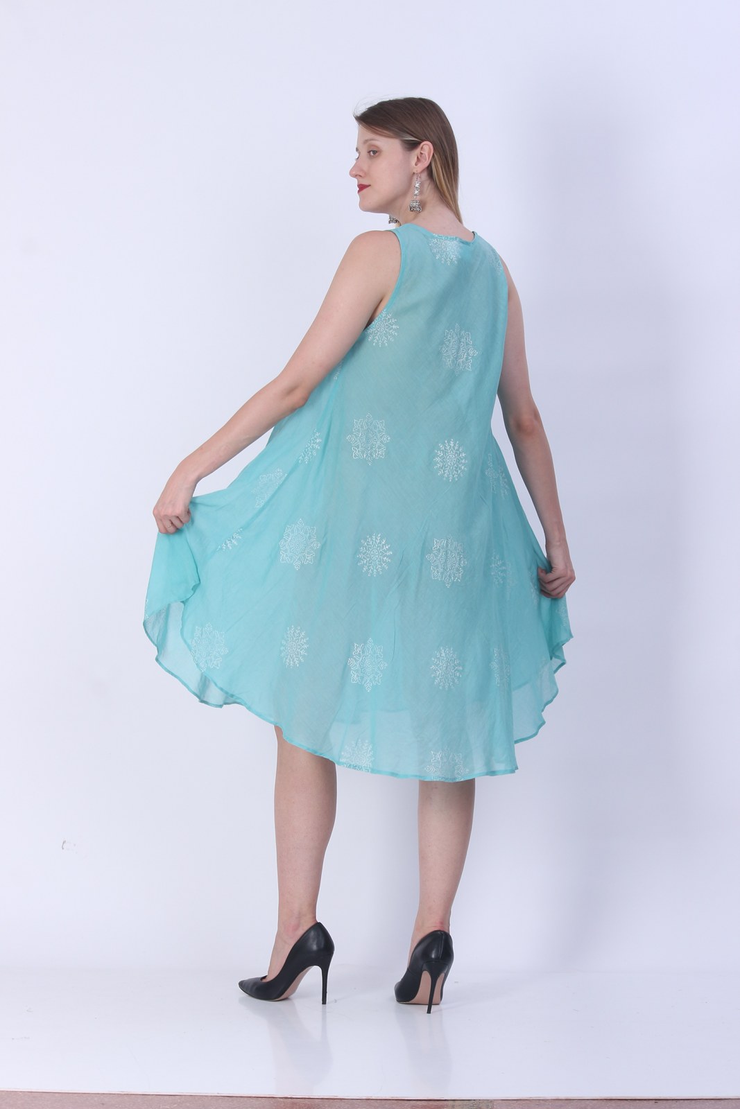 Aqua umbrella dress showing the flared back and swing hem