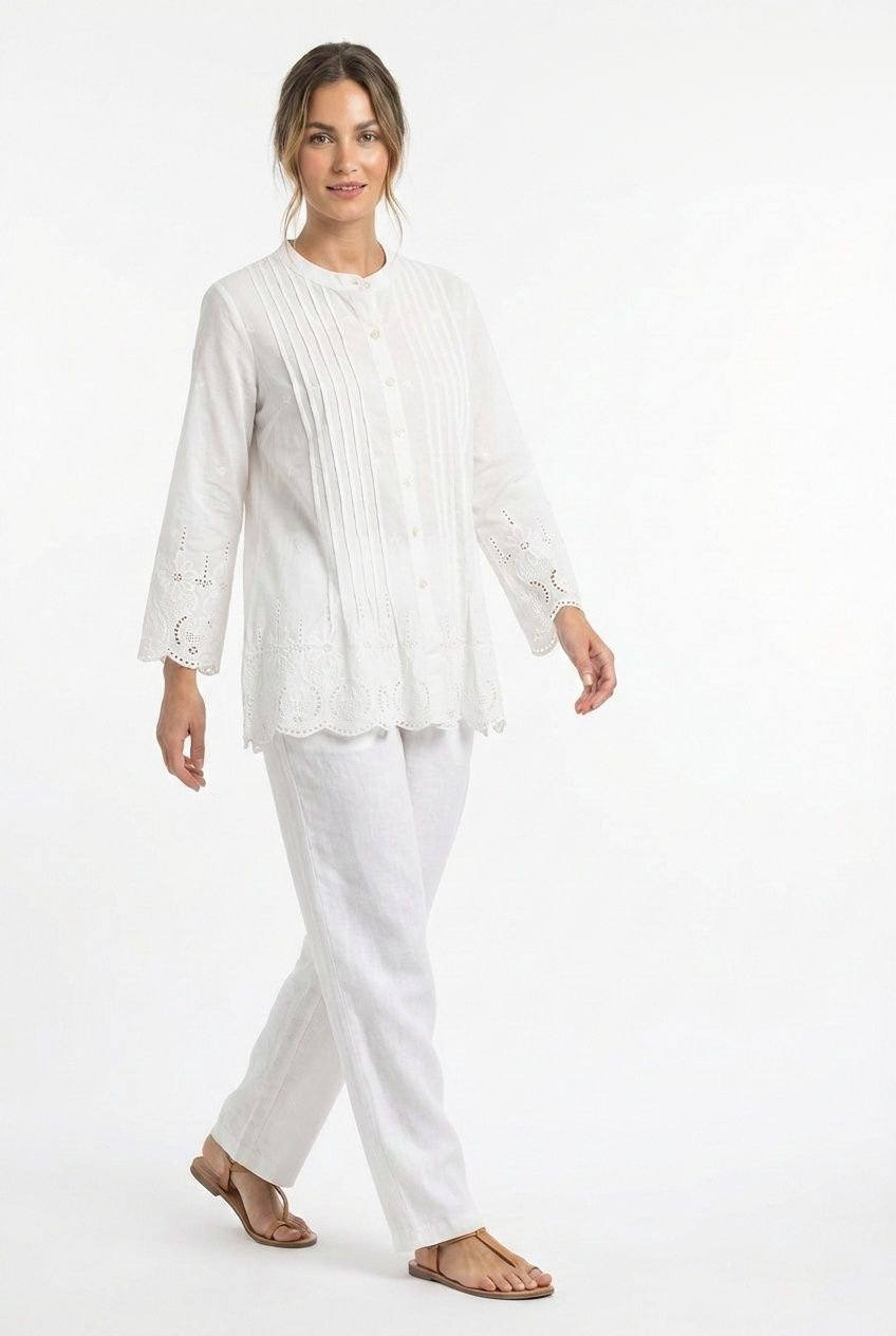 White cotton shirt with pin-tucks and a cutwork-embroidered scalloped hem.