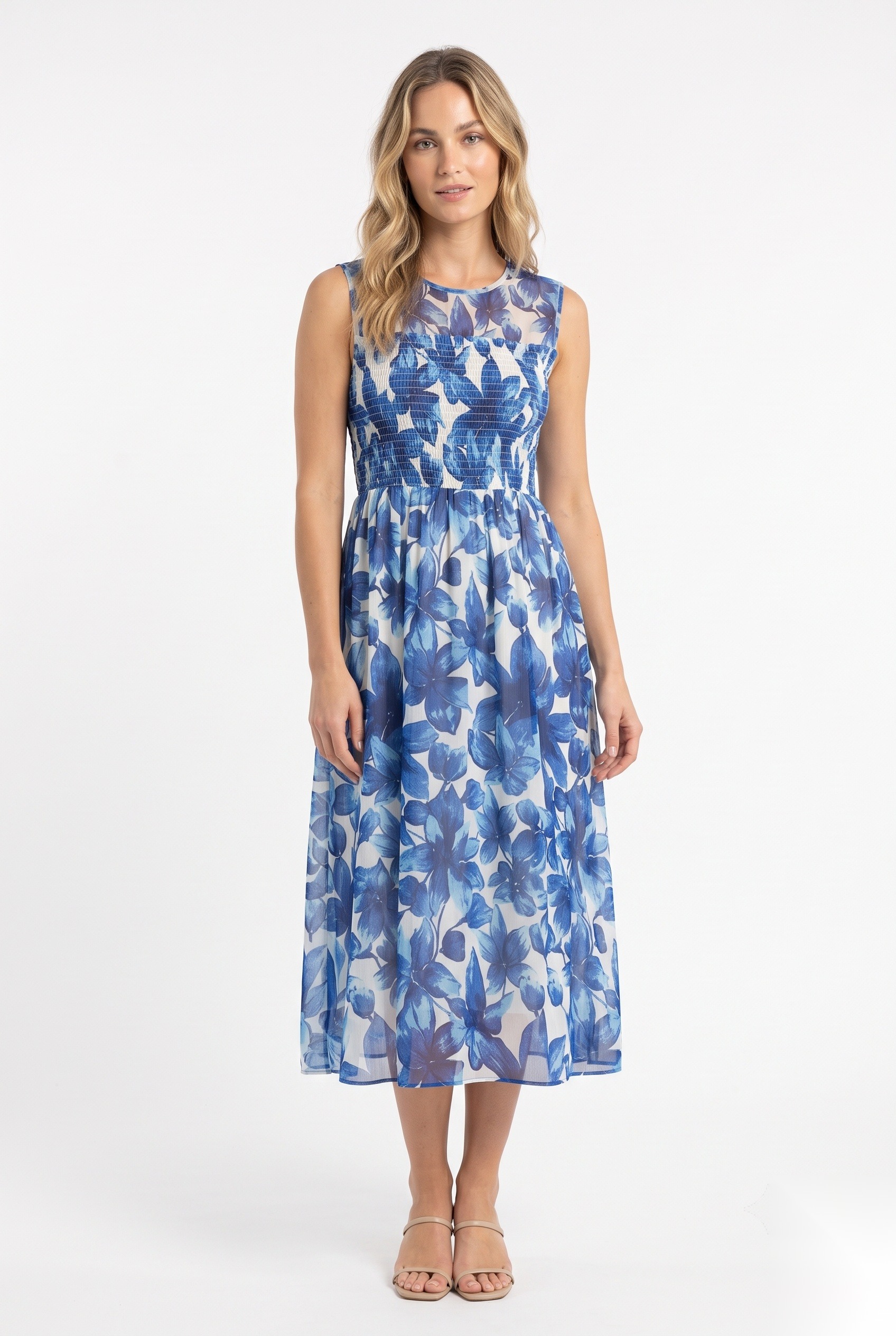 Chiffon smocked-bodice midi dress in a dense watercolor-style overlapping large five-petal blossoms and foliage print.