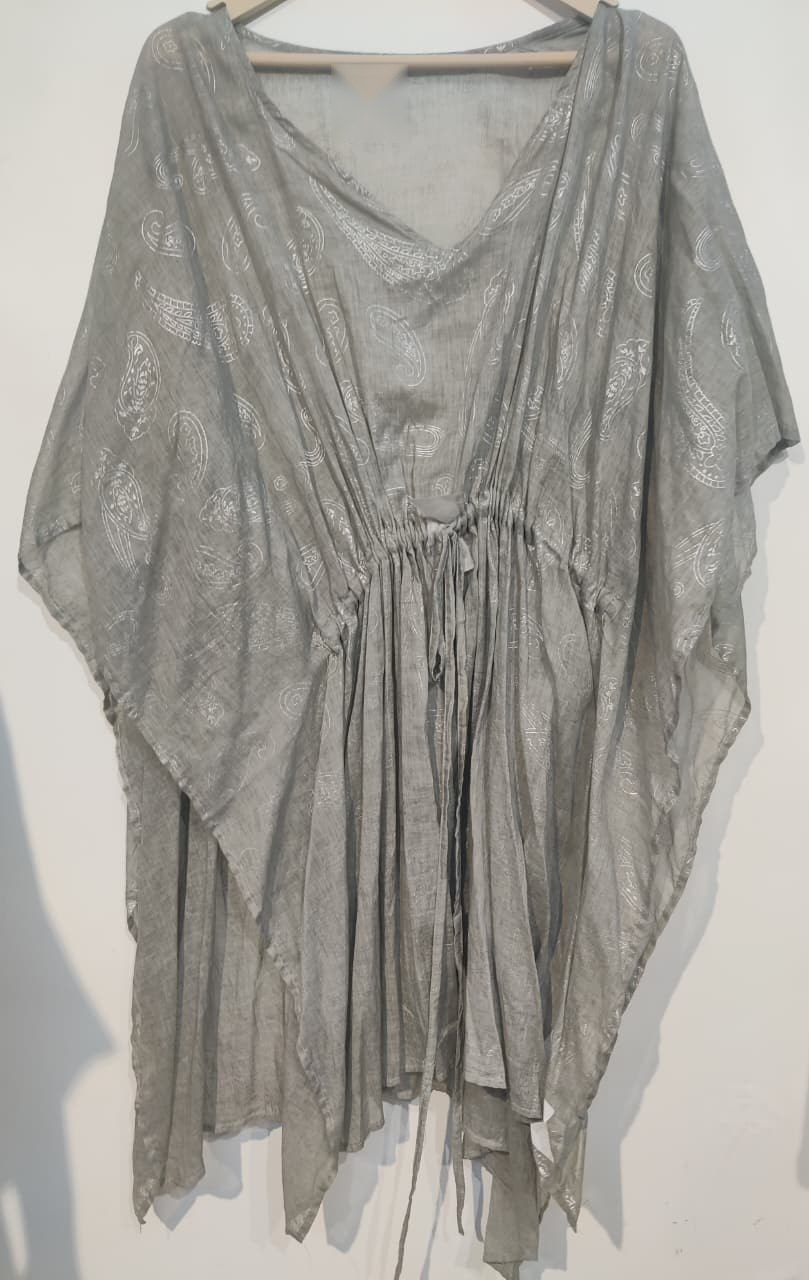 Sage green kaftan with a waterfall handkerchief hem on a hanger