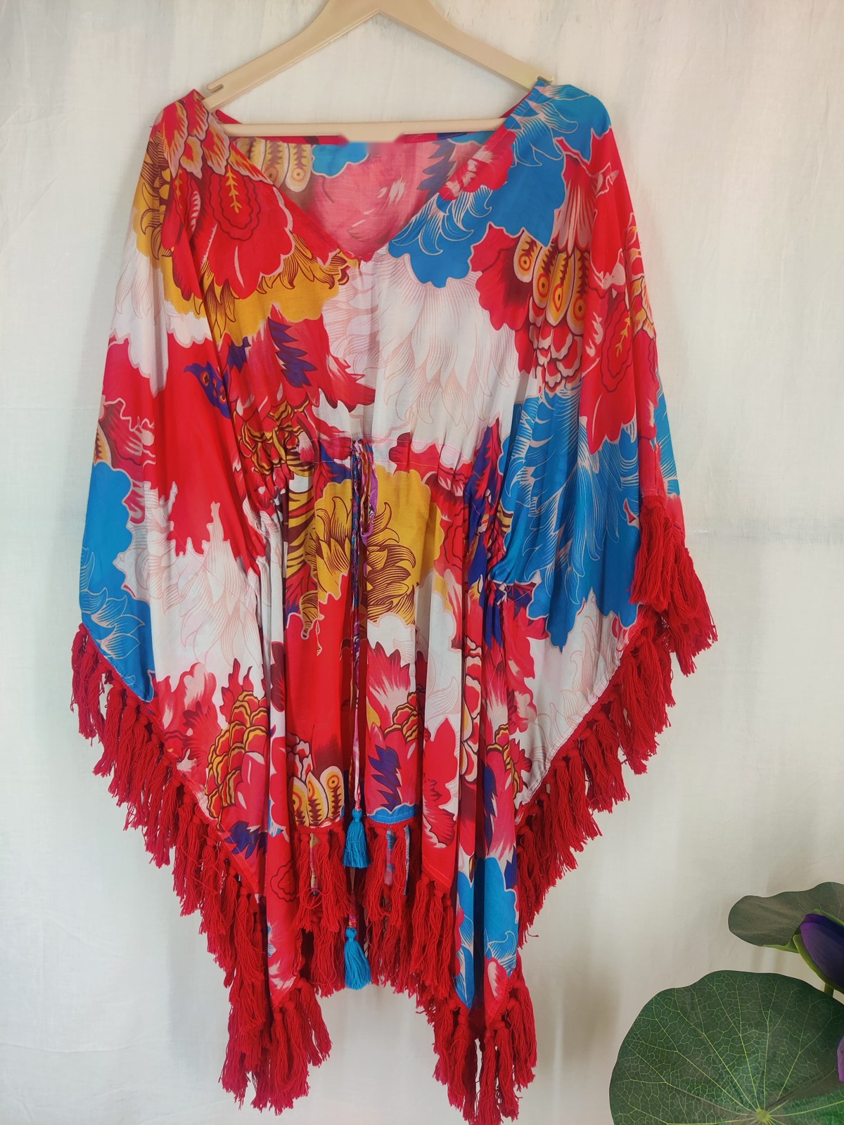 Red floral beach kaftan with a cascading tassel fringe hem
