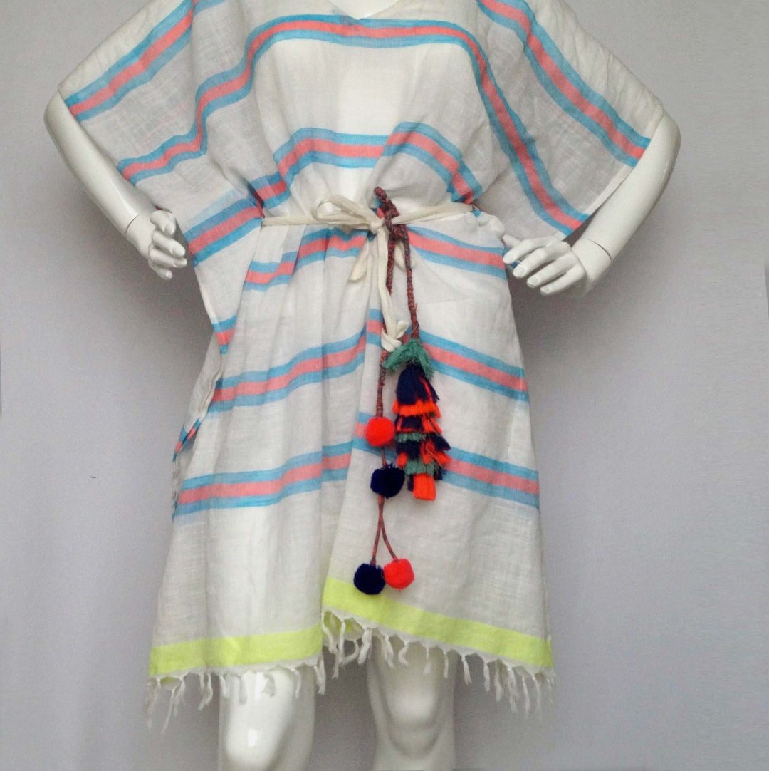 White cotton beach poncho with pink and blue stripes and pom-pom tie